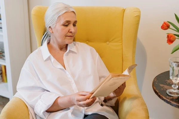 a woman reading a book In her perfect reading book